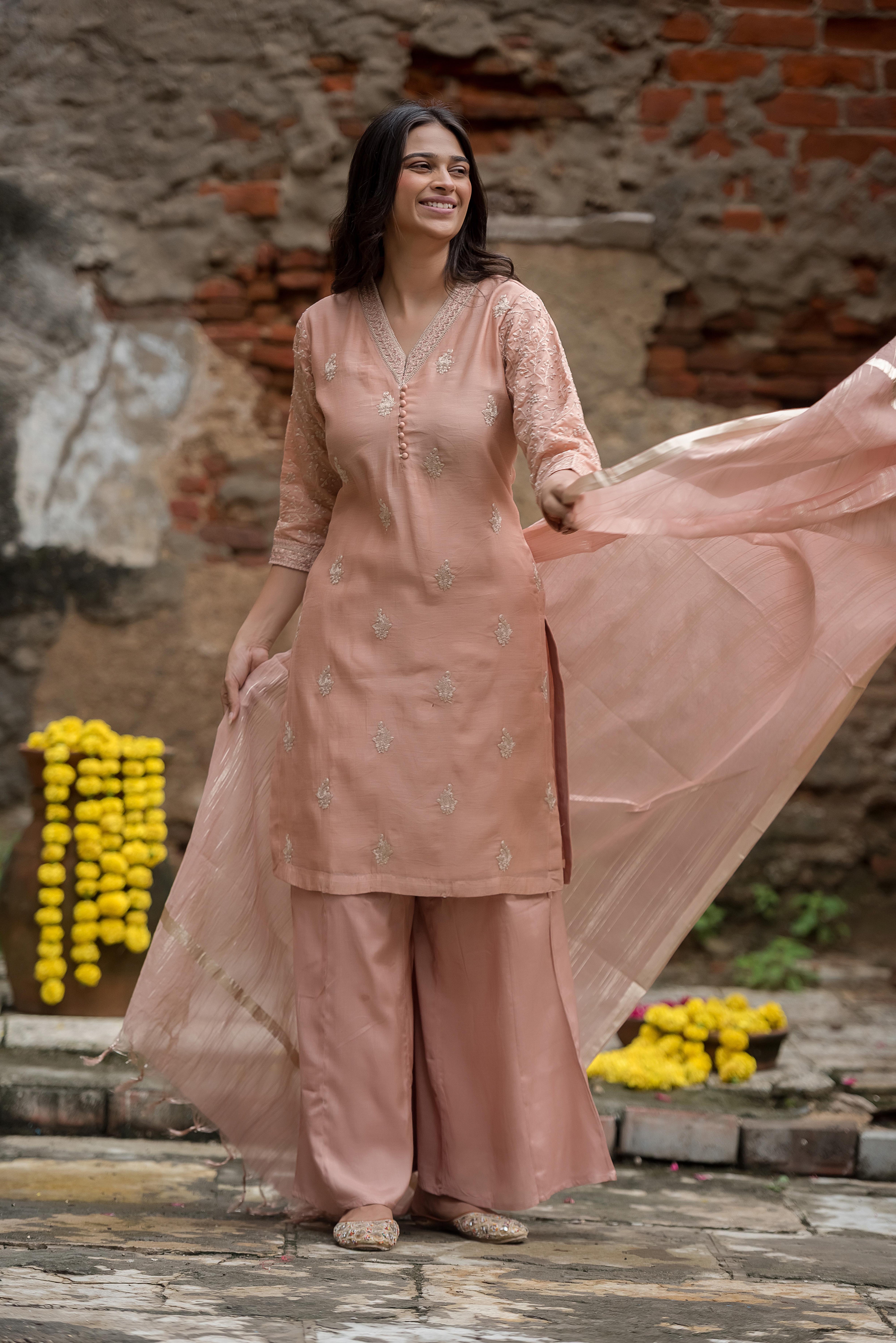 Elegant Peach Salwar Suit with Delicate Detailing