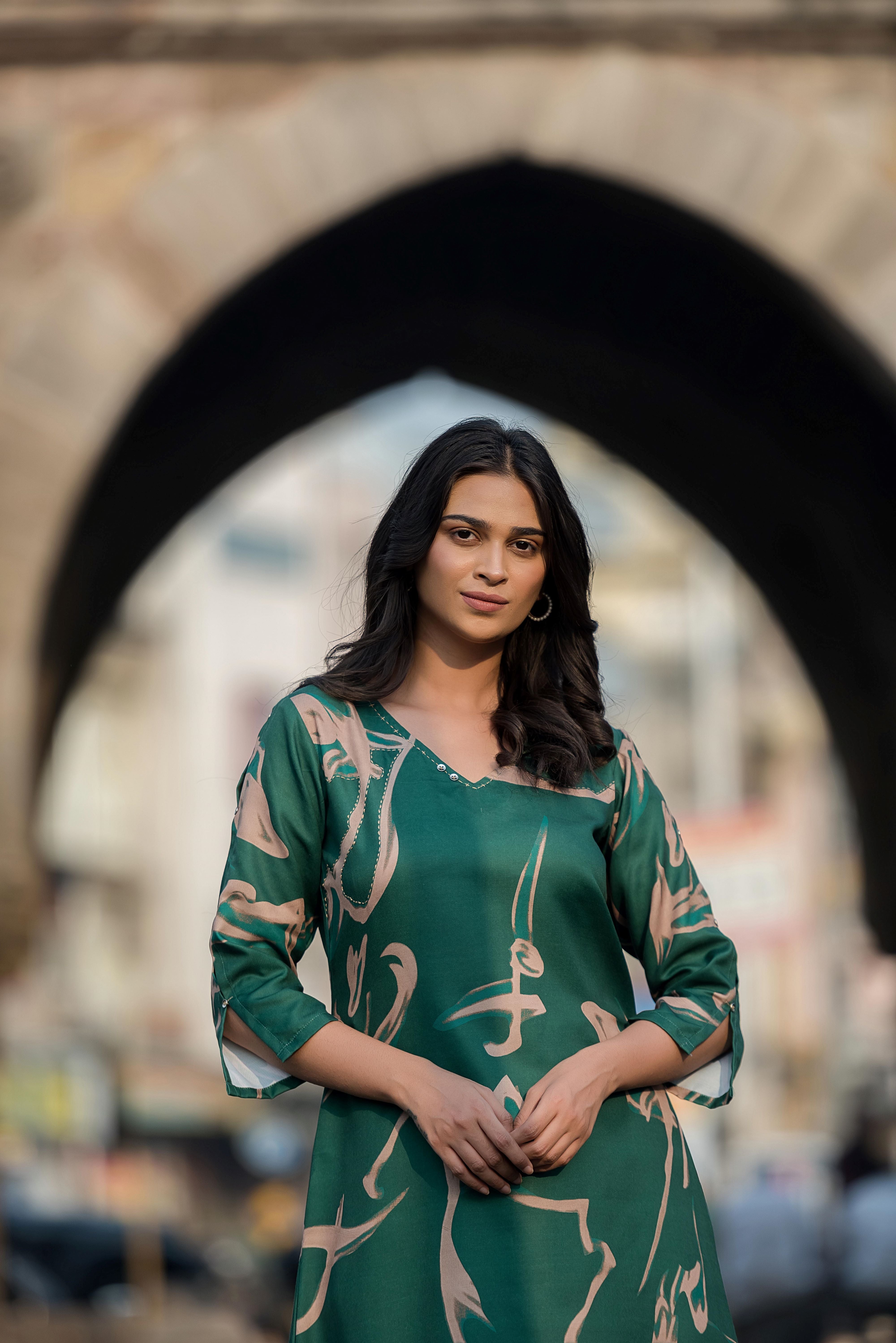 A Green Asymmetrica Poly Muslin Kurta Set