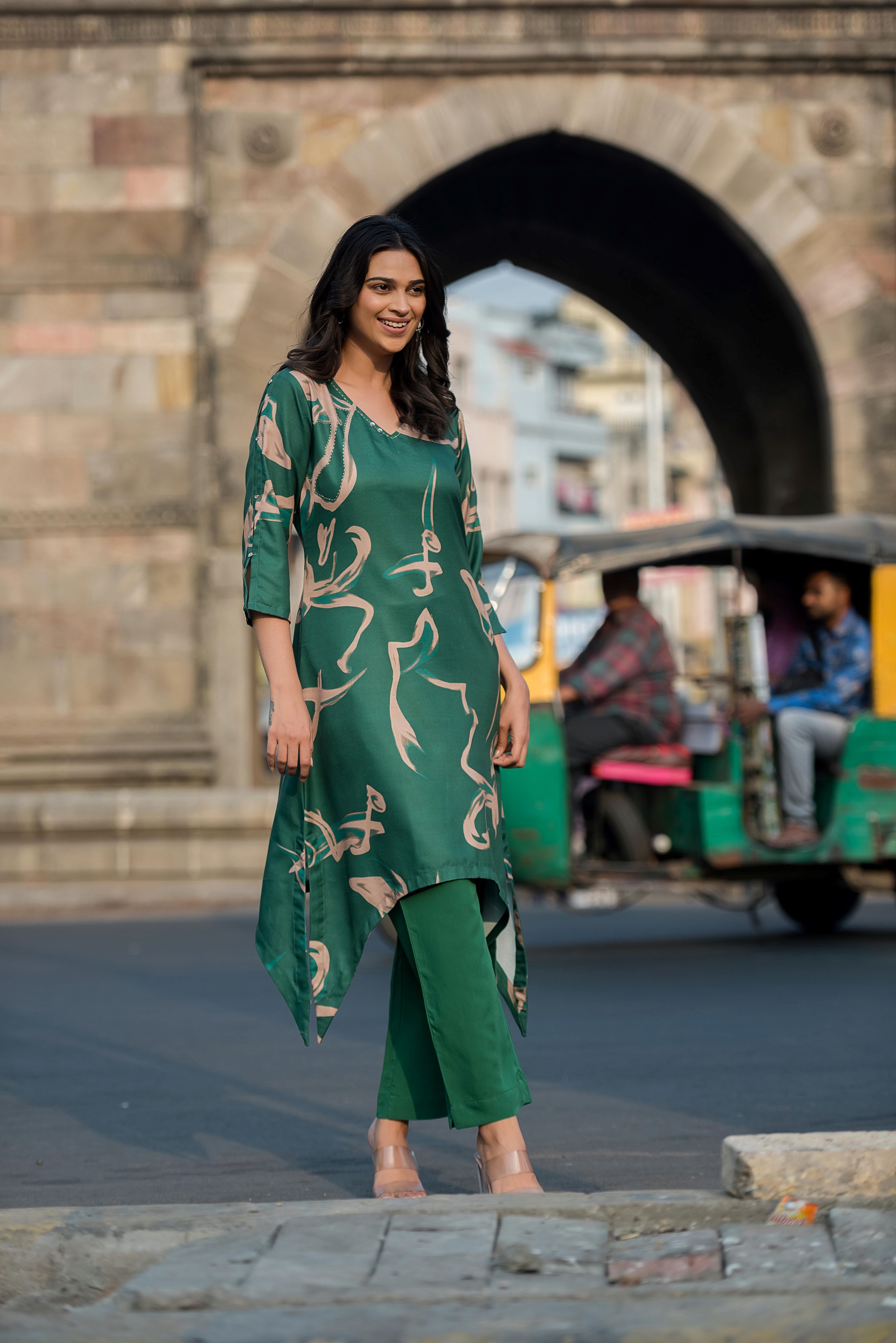 A Green Asymmetrica Poly Muslin Kurta Set